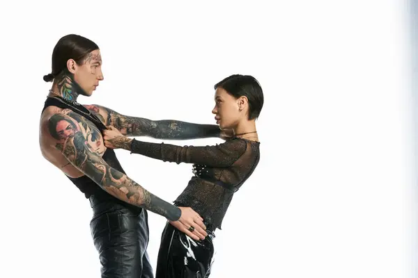 Young Stylish Couple Intricate Tattoos Arms Posing Studio Grey Background — Fotografia de Stock
