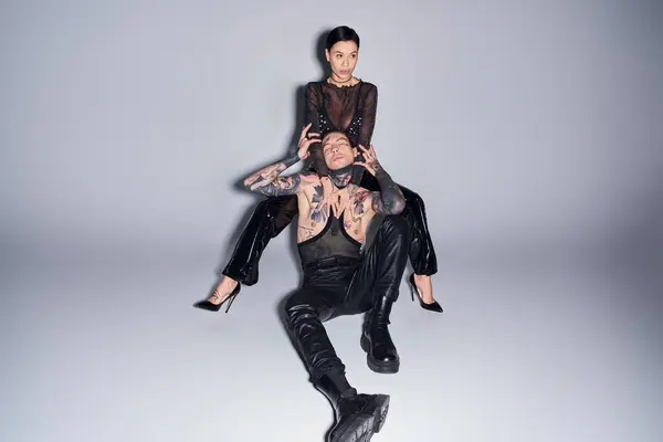 Stylish Tattooed Couple Studio Setting Woman Sitting Top Man Grey — Stock Photo, Image