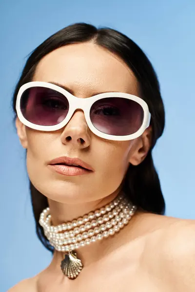 Stylish Woman Wearing Sunglasses Pearl Necklace Poses Studio Blue Background — Stock Photo, Image