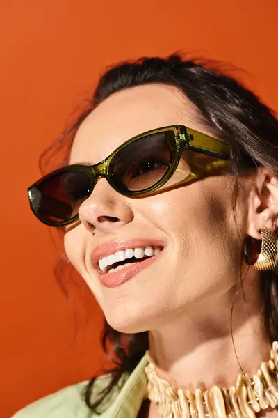 Fashionable Woman Exudes Summertime Chic Sunglasses Statement Necklace Orange Studio — Stock Photo, Image