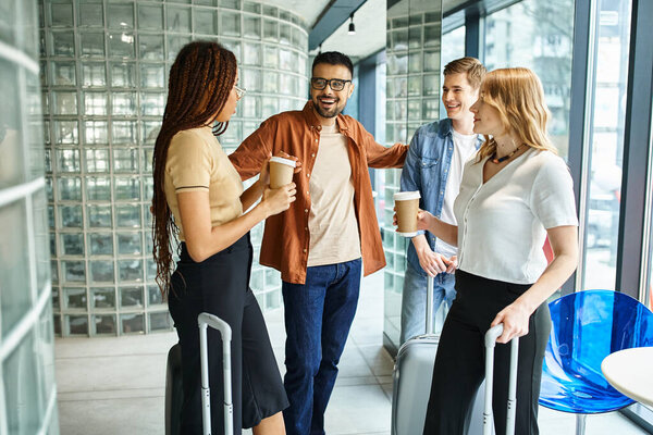 Multicultural colleagues gather in a circle, connecting and sharing during a corporate trip in a hotel.