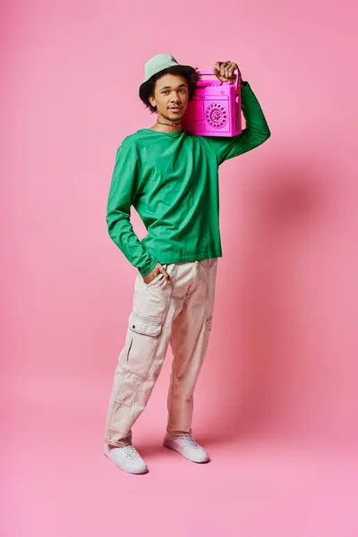 Cheerful Young African American Man Green Shirt Holds Pink Boombox — Zdjęcie stockowe