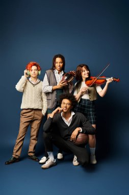 Diverse young friends, including a nonbinary person, in stylish attire, standing united with musical instruments against a dark blue background. clipart