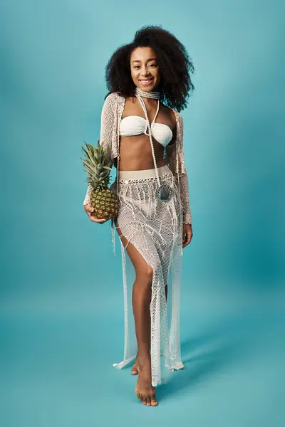 stock image Stylish African American woman in bikini holding pineapple.