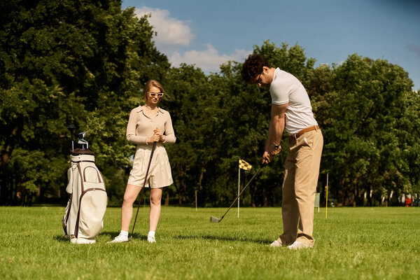 A young couple in elegant attire enjoys a game of golf on a lush green field at a prestigious club, embodying the epitome of upper-class leisure.