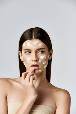 A beautiful young woman with a white cream covering her face, exuding mystery and elegance. clipart
