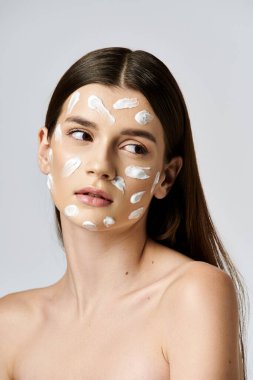 A stunning young woman wearing a white cream on her face, exuding mystery and elegance. clipart