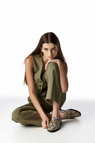 Stylish Woman Long Dark Hair Sits Serenely Ground Legs Crossed — Stockfoto