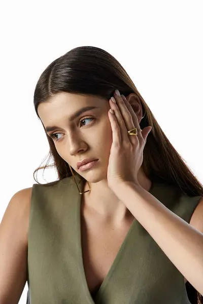 Stylish Woman Green Dress Listening Intently Hand Her Ear Exuding — Stock Photo, Image