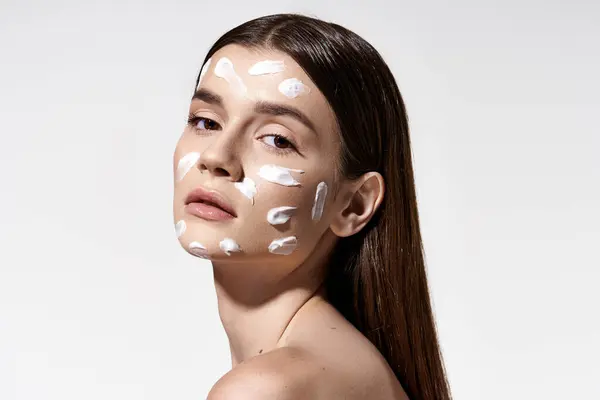 Young Woman Exudes Mystery She Dons White Cream Her Face — Stock Photo, Image