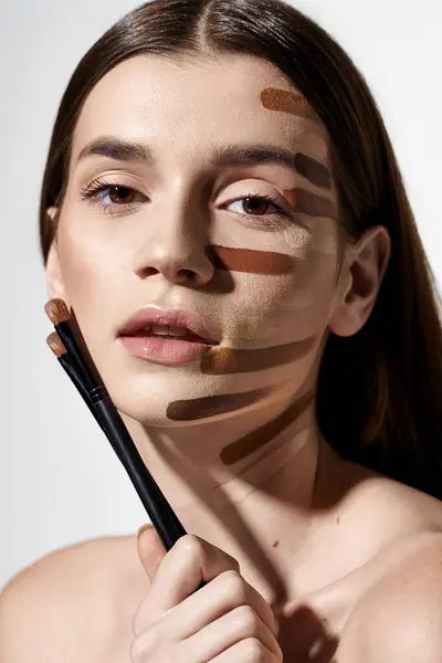 Polished Young Woman Showcasing Beauty Products Foundation — ストック写真