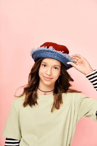 Stylish Teenage Girl Striped Shirt Hat Poses Confidently Vibrant Attire — Stockfoto