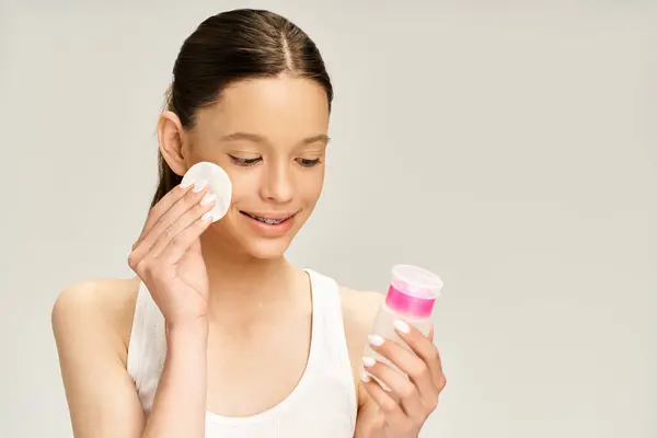 Stylish Teenage Girl Gracefully Holds Two Small Containers Cream Her — Stockfoto