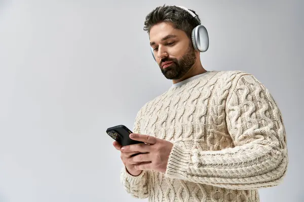 Bearded Man Wearing Headphones Gazes His Phone Lost Music Playing — Stockfoto