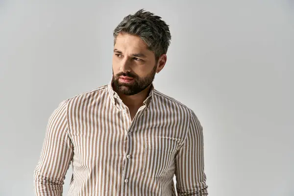 Bearded Man Elegant Striped Shirt Strikes Pose Grey Studio Background — Foto Stock