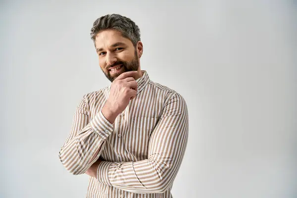 Stylish Man Beard Poses Elegant Attire Grey Background Studio Setting — Stockfoto