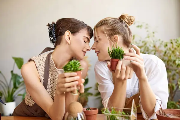 Two Women Enjoying Serene Moment Table Surrounded Potted Plants Art — Photo