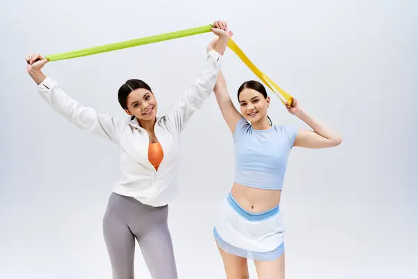 Two Pretty Brunette Teenage Girls Sportive Attire Stand Together Grey — Foto de Stock