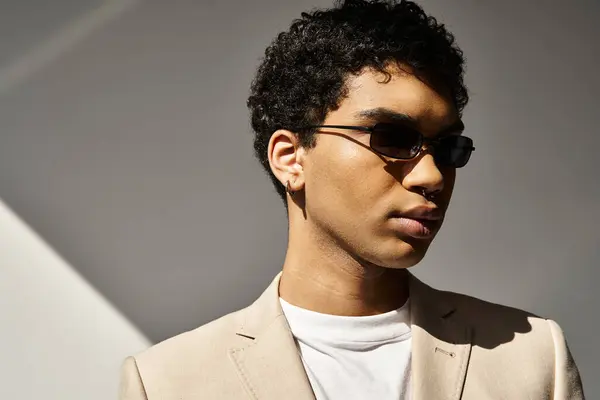 stock image Stylish African American man in tan suit and sunglasses.