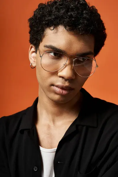 stock image Young African American man in black shirt and glasses.