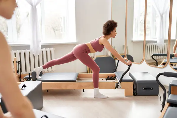 stock image Two women exercising actively, pilates.