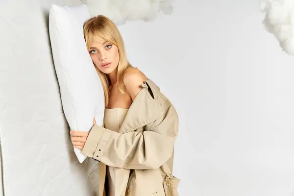 Stylish Woman Trench Coat Holding Pillow — Stock Photo, Image
