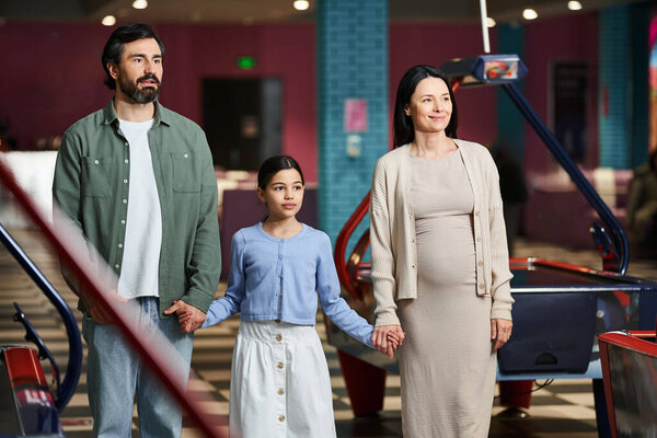 A man and woman lovingly hold hands while having fun during the weekend.