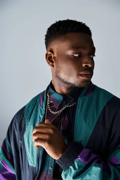 Stock image Handsome African American man posing in stylish, colorful jacket.