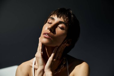 Stressed woman in stylish clothes with hands on face
