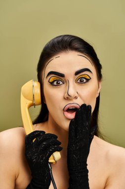 Brunette woman in pop art makeup and black gloves holds phone to face. clipart