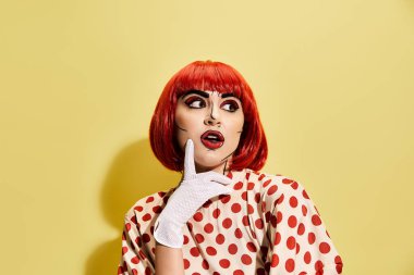 A striking redhead in a polka dot dress stands against a yellow background, exuding a vibe straight out of a comic book. clipart