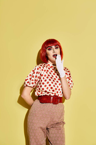 A vibrant redhead woman adorned in polka dots and bold makeup against a yellow backdrop, resembling a character from comics.