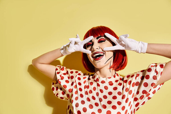 A captivating redhead woman, with pop art makeup and polka dot blouse, conceals her eyes with white gloves on a yellow background.