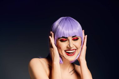 A stunning woman with purple hair and vibrant pop art makeup strikes a pose against a dark backdrop. clipart