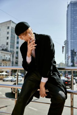 Elegant man in suit and hat smoking a cigarette. clipart