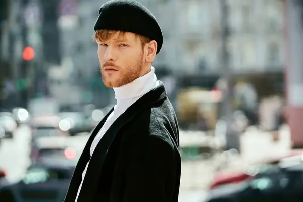 stock image A young man with red hair strolling through the city in debonair attire.