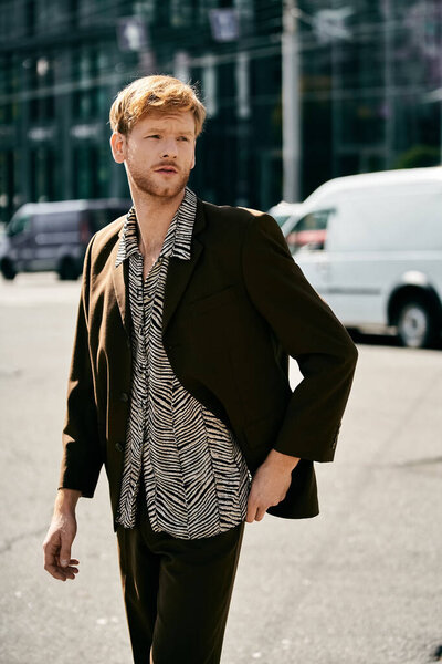 A young red-haired man, dressed in debonair attire, stands confidently in the middle of a bustling city street.