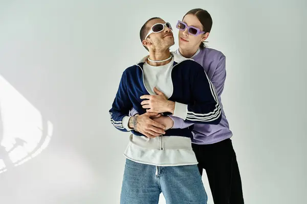 stock image two men share a moment standing together.