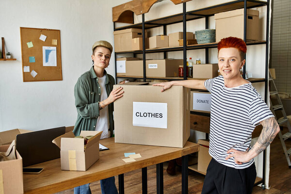 volunteers in a room, sorting through boxes and organizing items together.