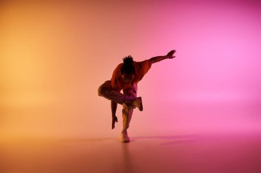 young african american hip hop dancer in motion on gradient background  clipart