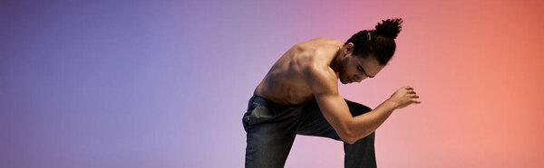 A young African American man dances against a colorful gradient background, his body moving with grace and energy.