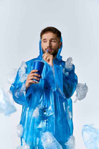 A man in a blue raincoat surrounded by plastic.