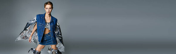 Stylish woman in denim vest and skirt flaunts sustainable fashion