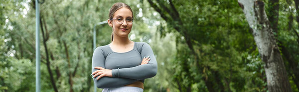 A young woman confidently engages in her outdoor workout routine.