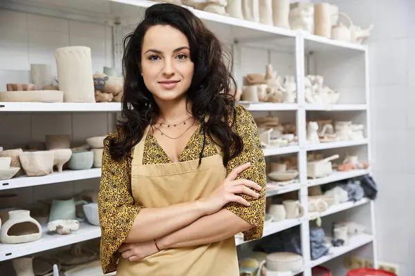 stock image Attractive woman posing in pottery studio.