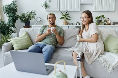 Friends sharing laughter and warmth over coffee in a bright, inviting space. clipart