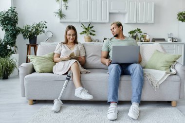 A non binary person shares a relaxed moment with a friend on the sofa. clipart