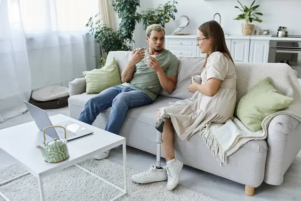 stock image Two friends share a moment together while relaxing in a cozy living room.