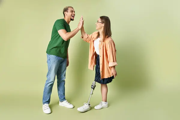 stock image Two friends share a joyful high five in a cheerful atmosphere.