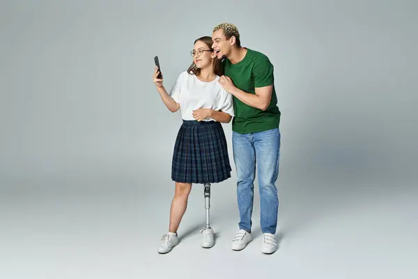 stock image Friends enjoying a fun moment while taking a selfie together.